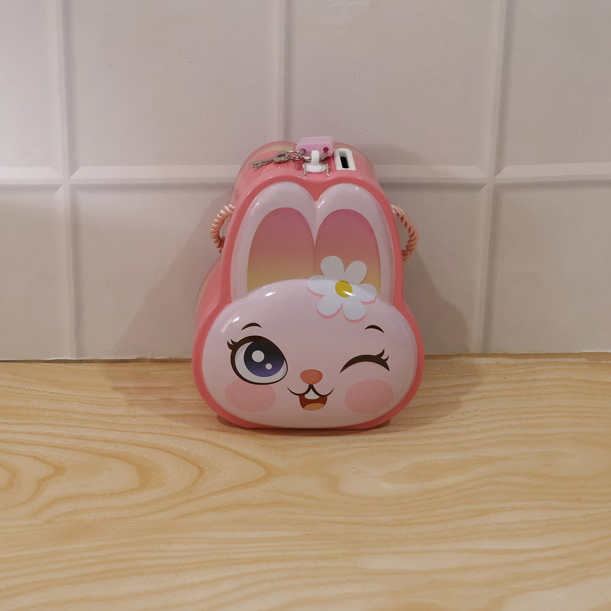Playful pink bunny money box with lock and bright design