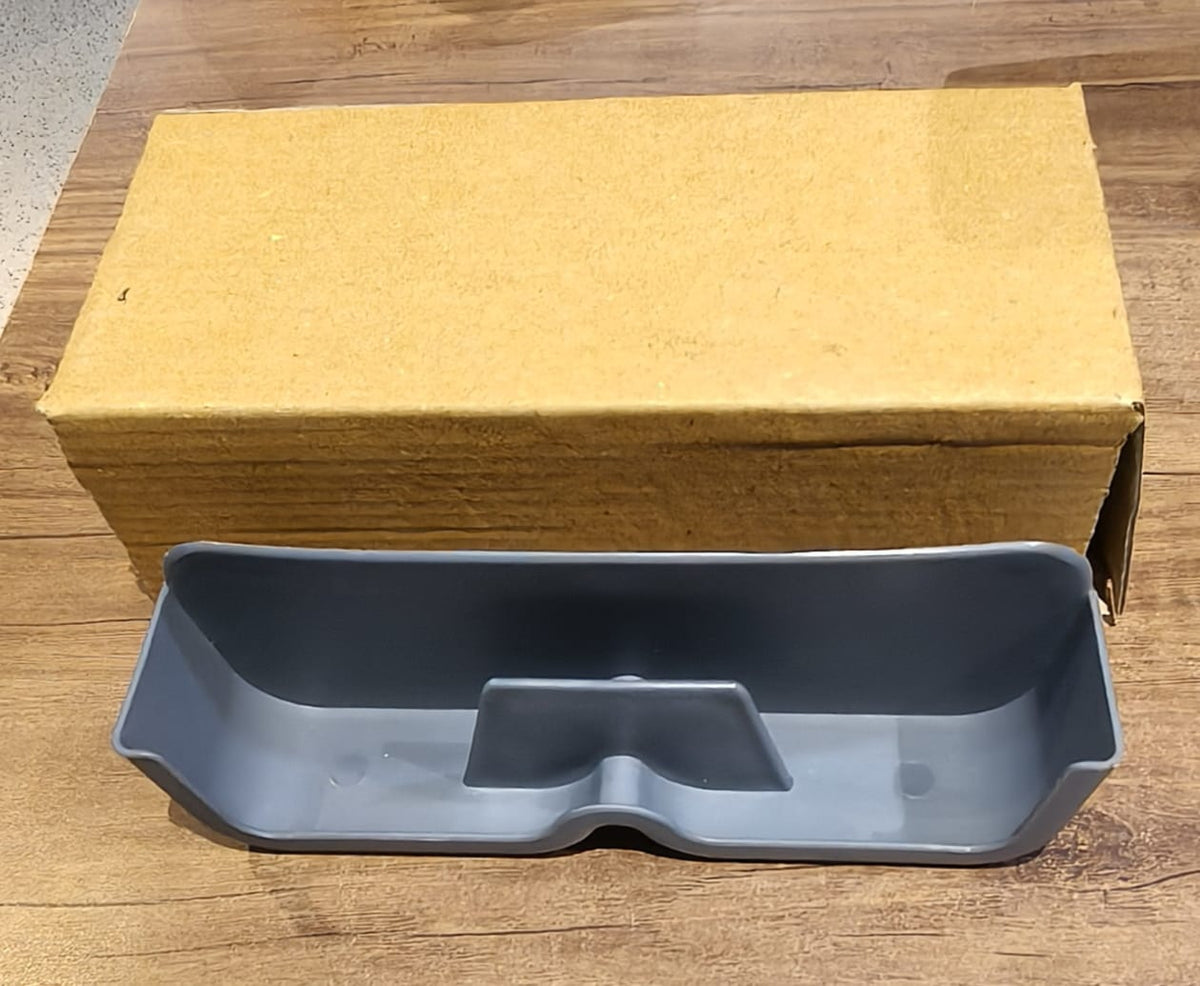 Sunglasses holder mounted on wall beside door for easy access