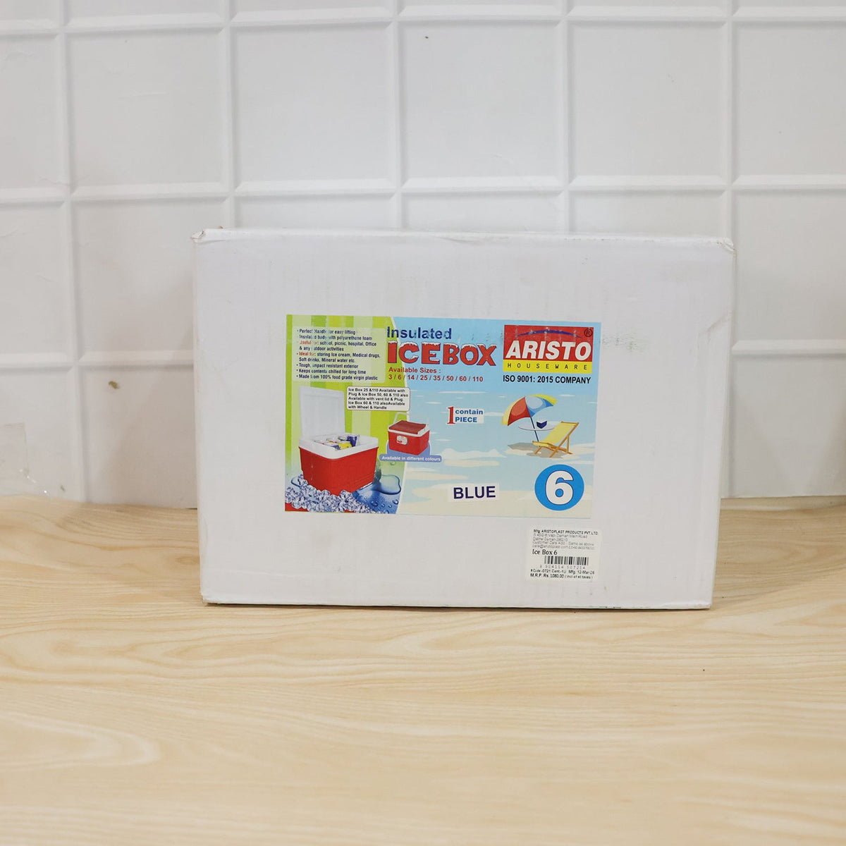 Blue portable insulated cooler box in use for outdoor outings