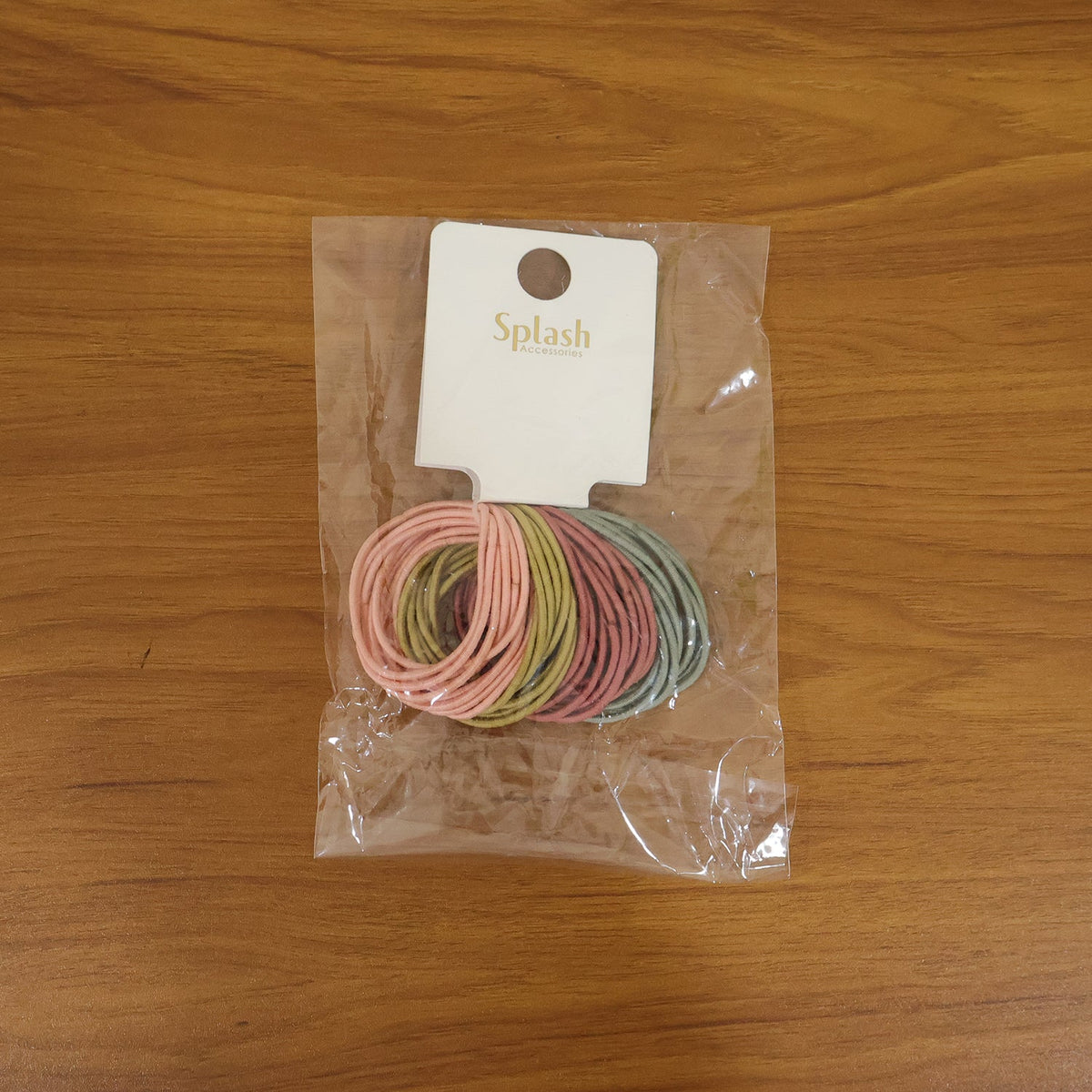 Lifestyle shot featuring an elastic hair band in use, providing a soft and secure hold.