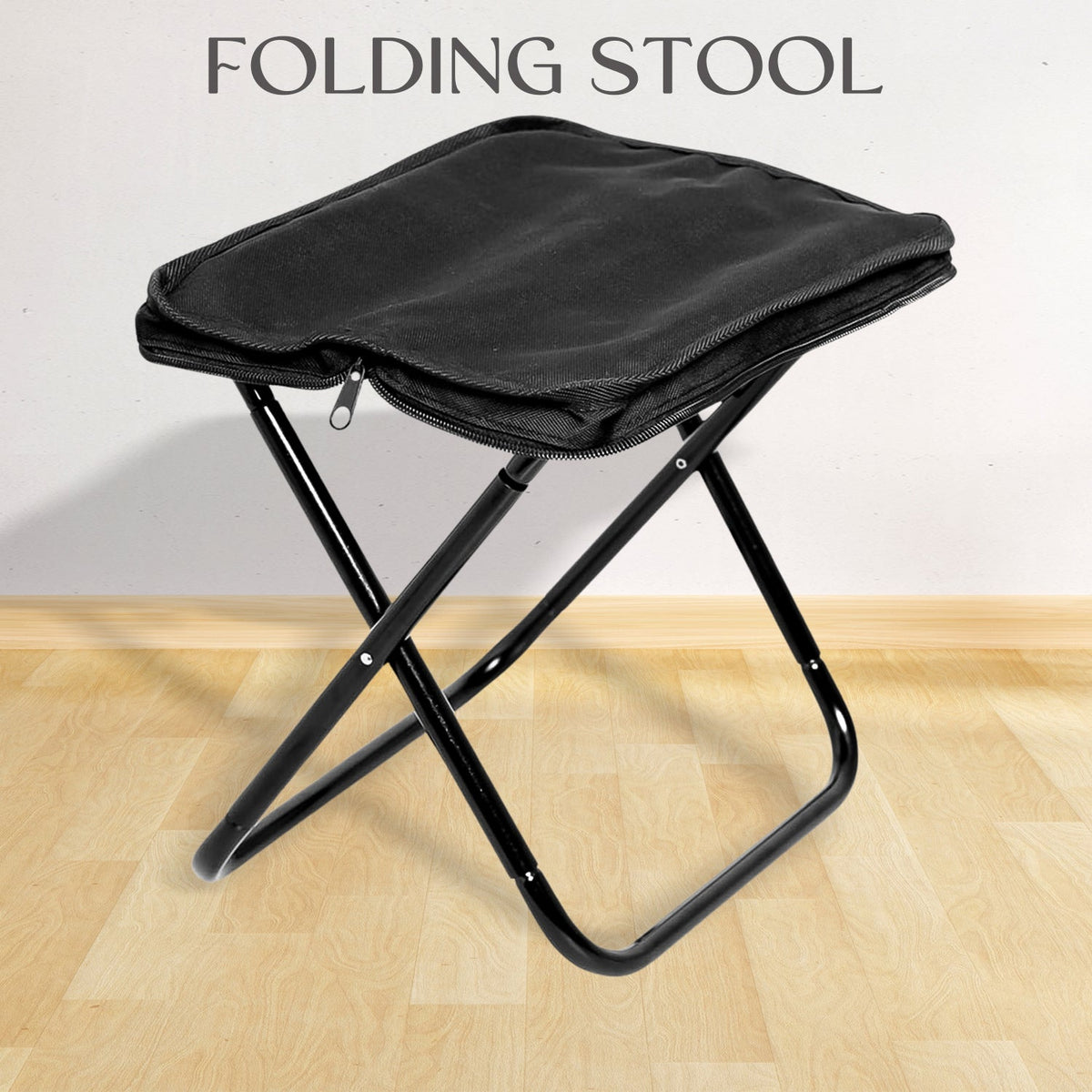 Folding Camping Stool set up in a lush green outdoor setting, ready for use.
