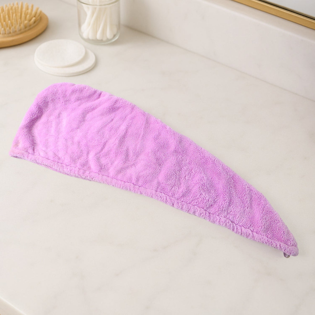 VelvaBloom Microfiber Hair Drying Towel neatly folded, ready for use or travel.