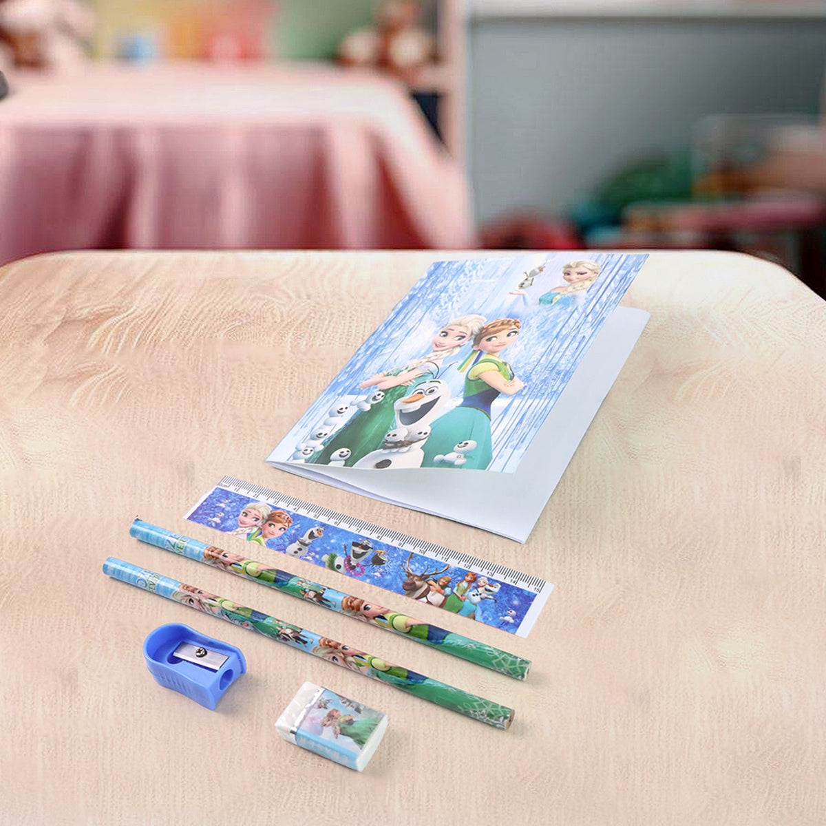 Close-up of a vibrant wooden pencil featuring a playful cartoon design from the stationery kit.