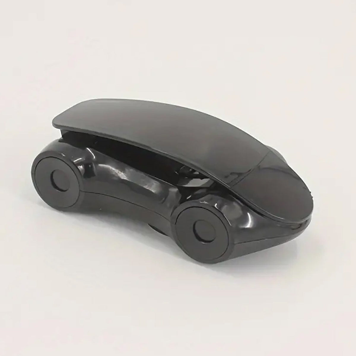 Stylish red sports car phone holder positioned on a car dashboard.
