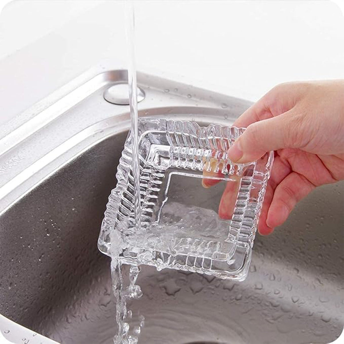 A square crystal ashtray, reflecting light beautifully on a tabletop.