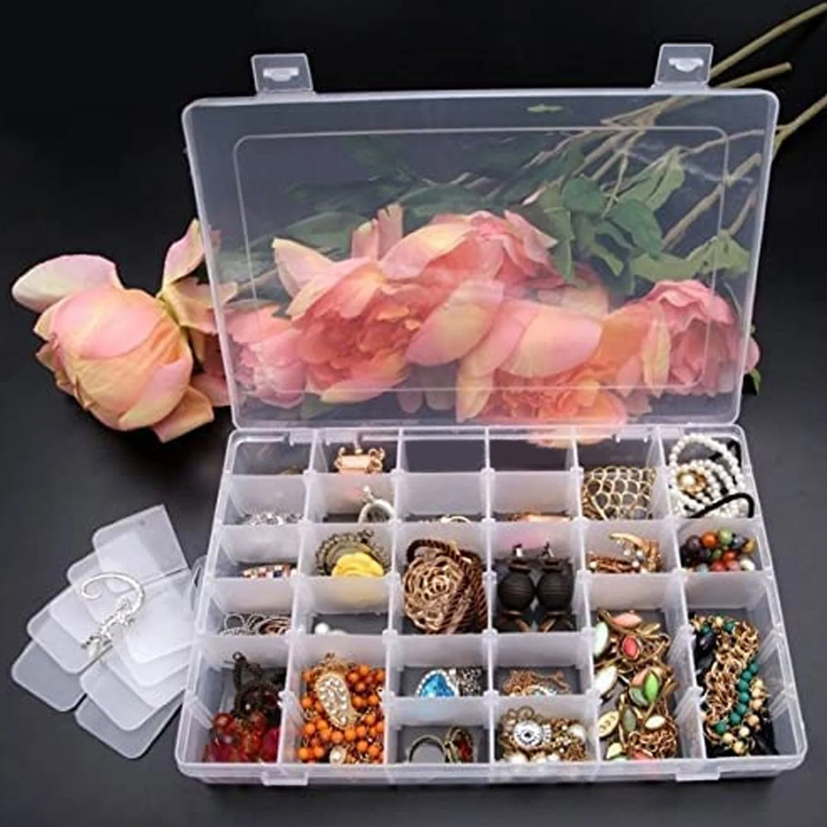 Clear plastic organizer box with 36 adjustable grids for versatile storage.