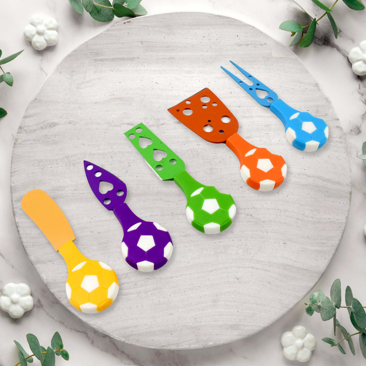 Close-up of the sports-inspired cheese knife set with various blades.