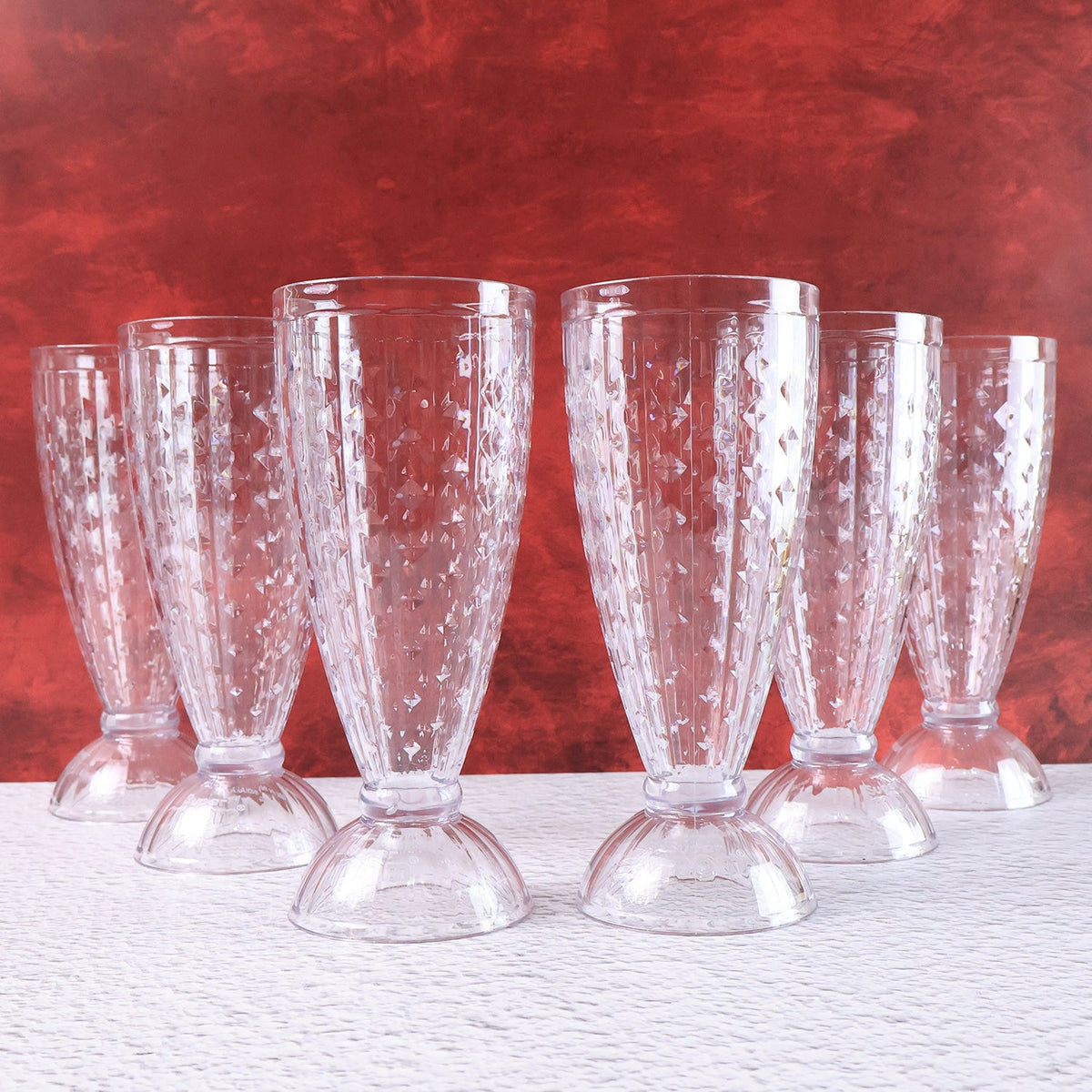 Milkshake glass highlighting footed base and diamond-cut crystal texture