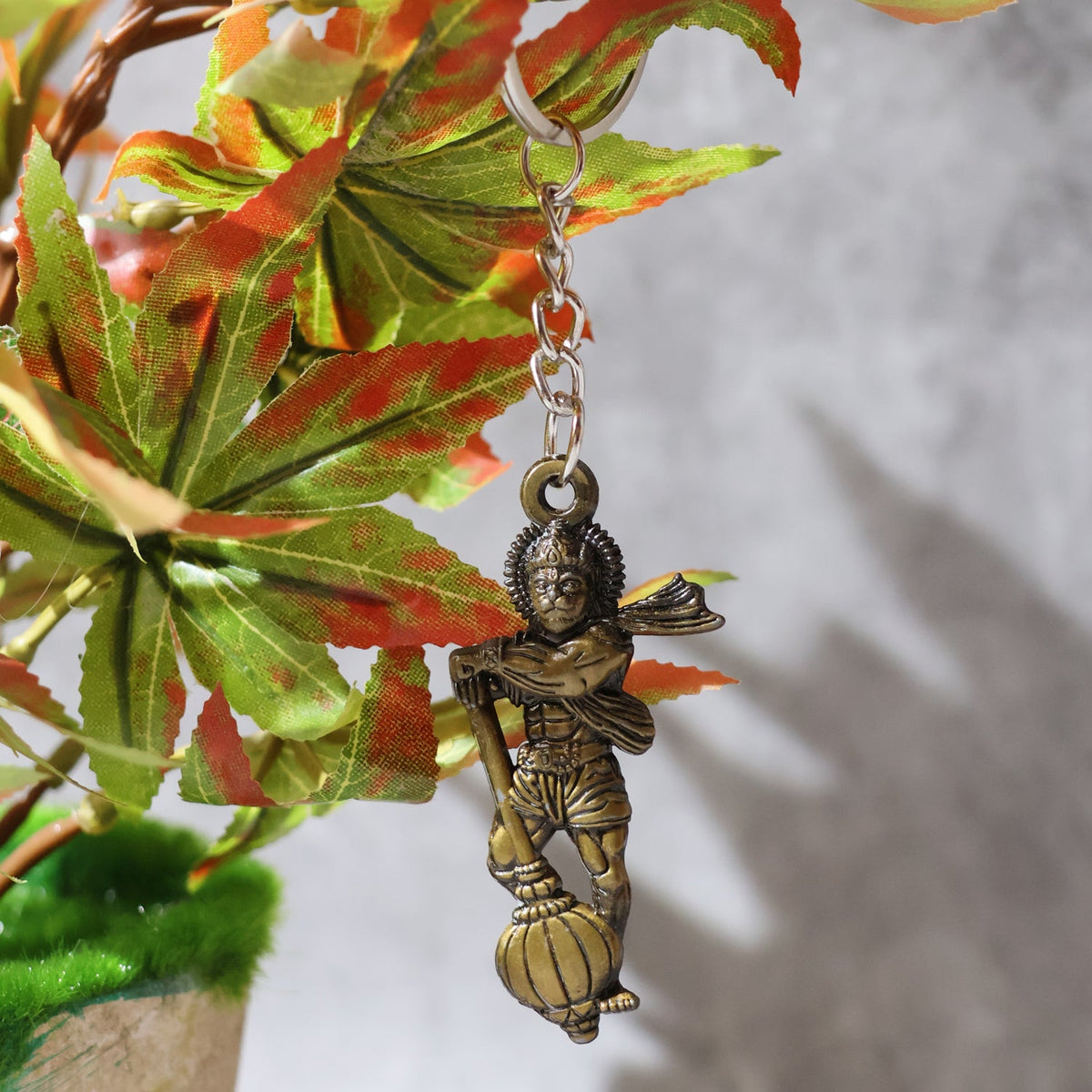 Side angle of the Lord Hanuman metal keychain showing craftsmanship