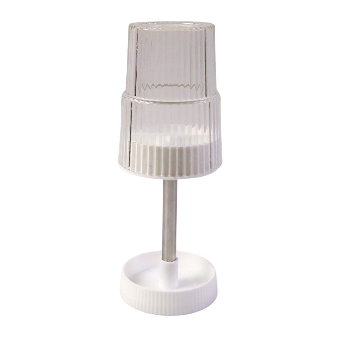 Storage slots of rotating toothbrush holder stand holding toothbrush and toothpaste