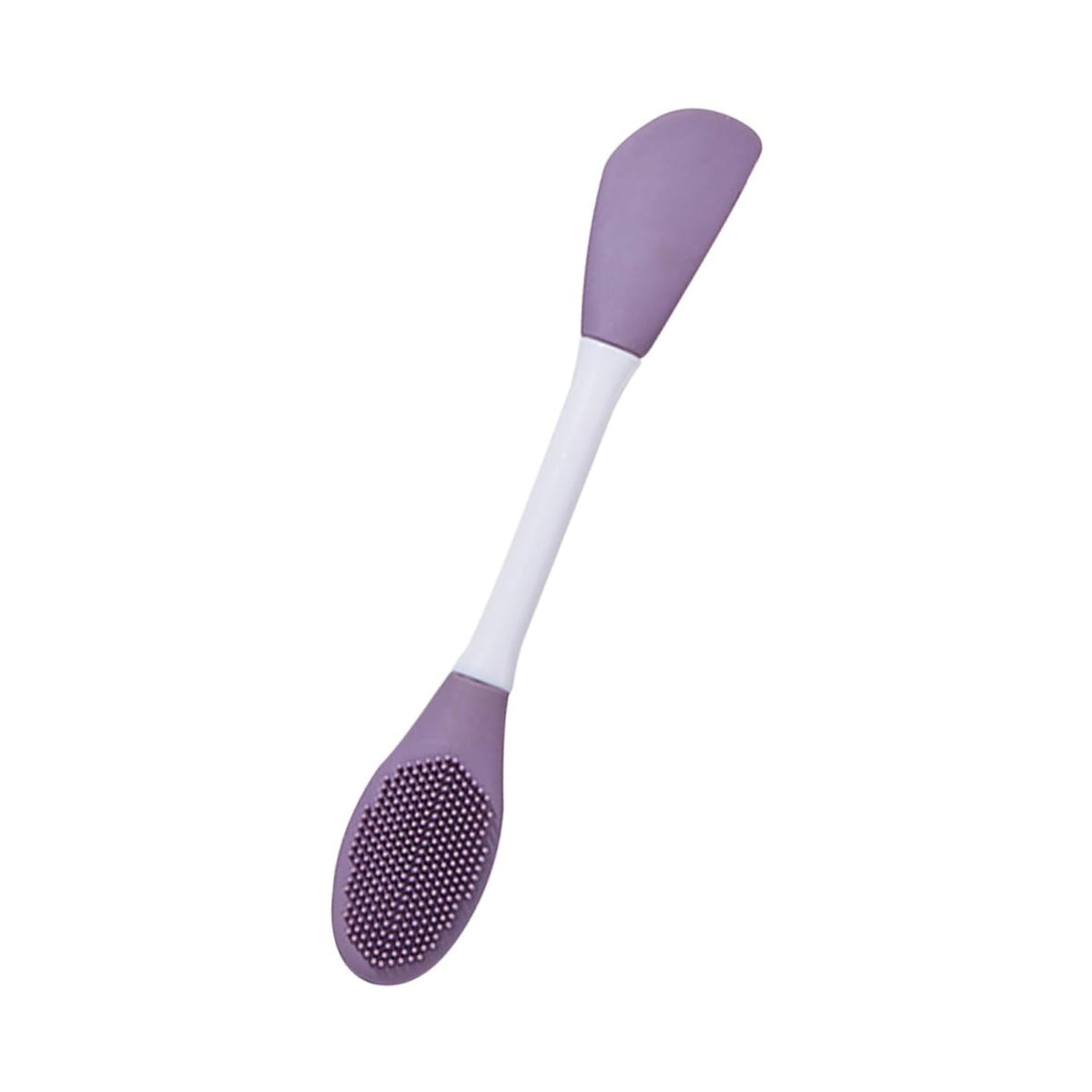 The versatile silicone mask brush shown applying a green clay mask to a face.