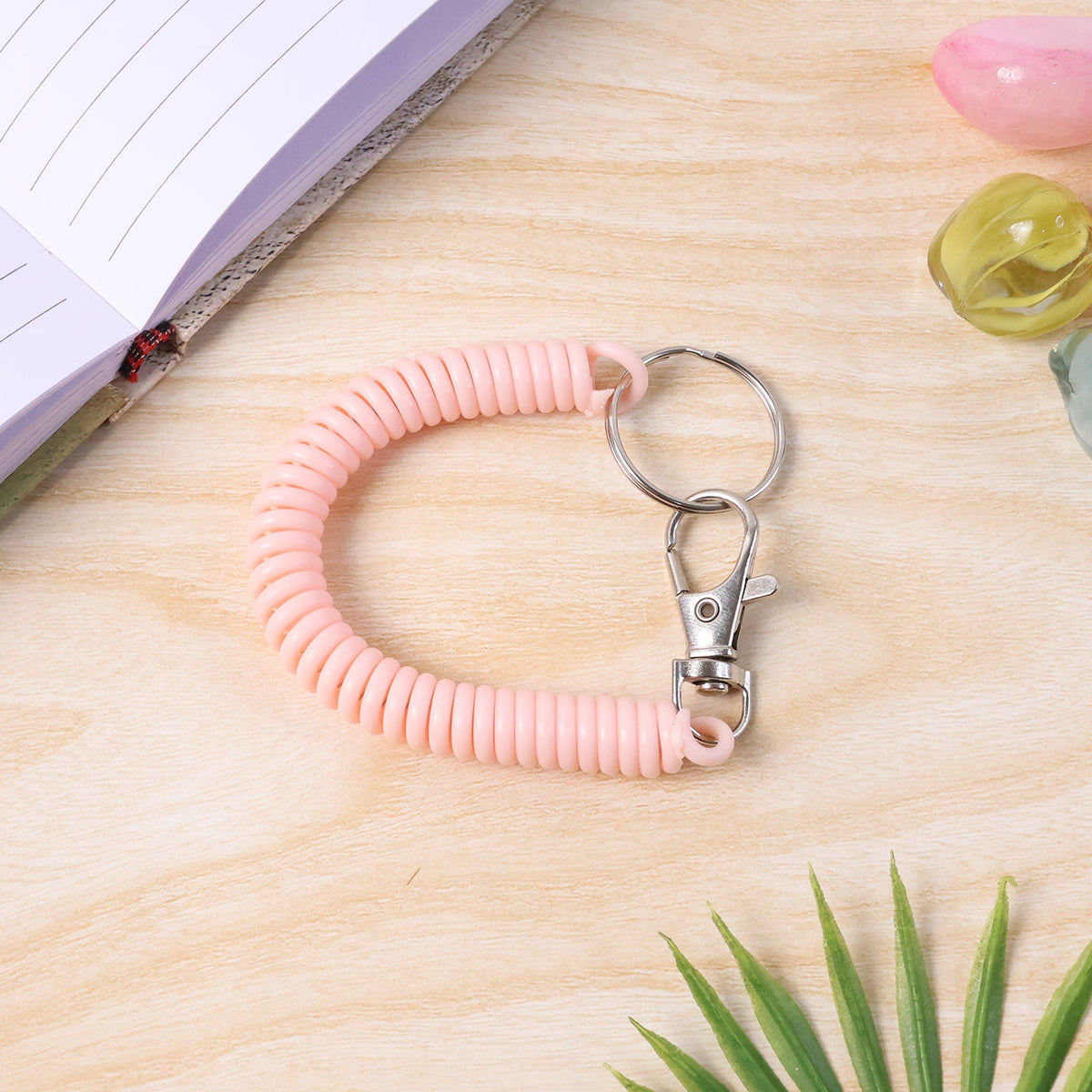 Key holder wristband featuring durable metal key ring attachment