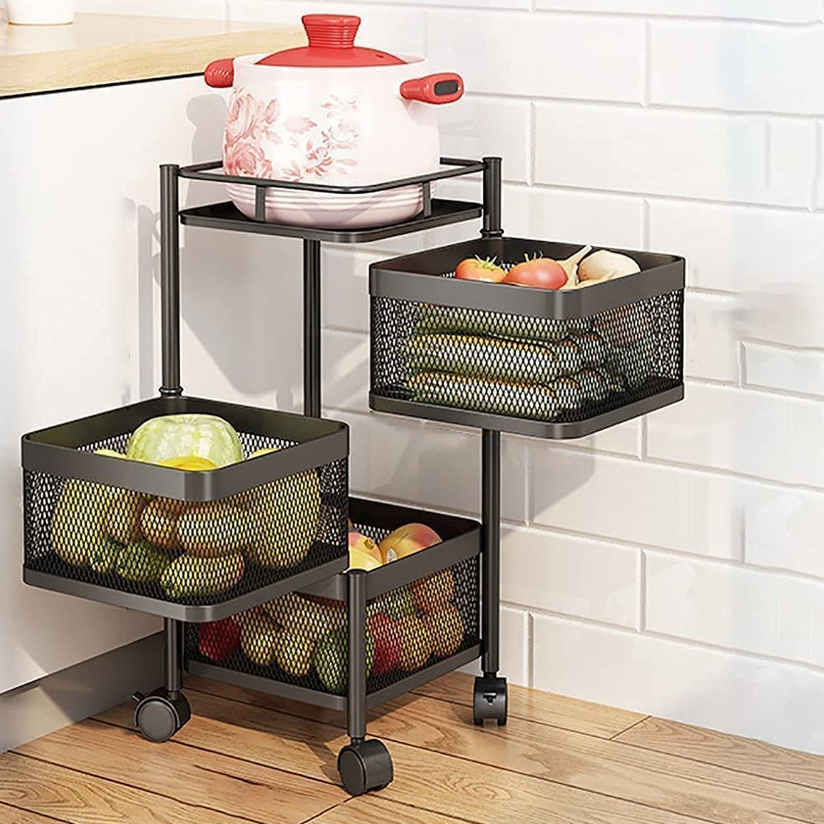 CookAura 3-layer metal kitchen trolley with rotating baskets for fruit storage.