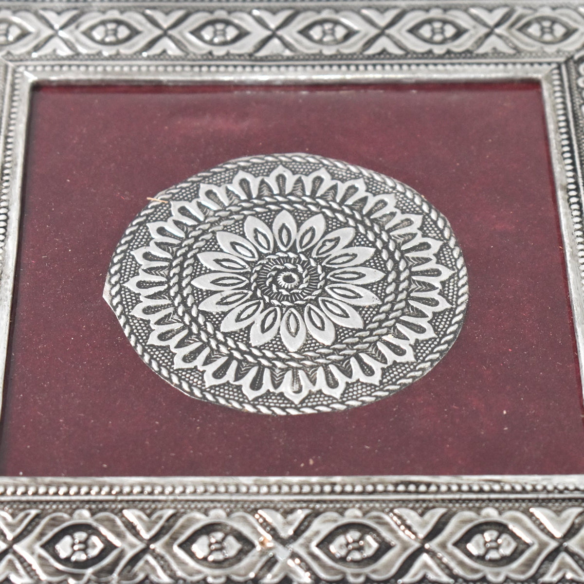 Top view of the silver pooja chowki, showcasing its exquisite mandala pattern and finish.