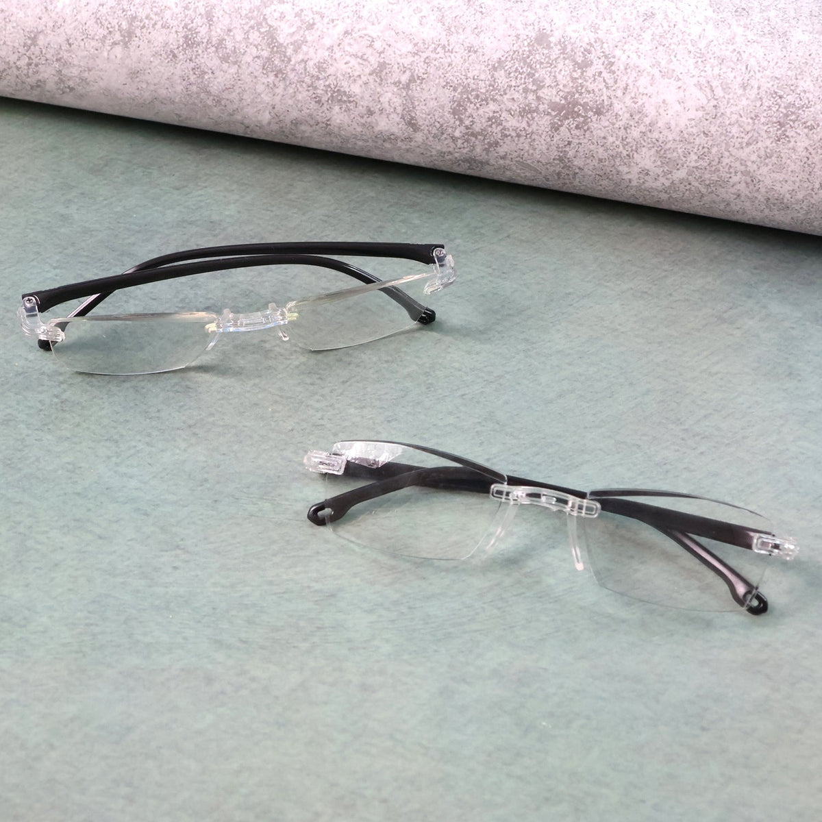Protective case storing lightweight rimless reading glasses for travel