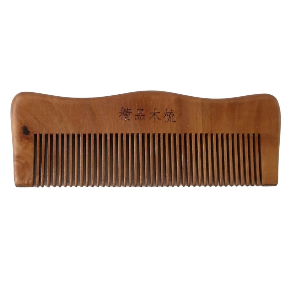 Wooden comb on white background highlighting natural wood finish