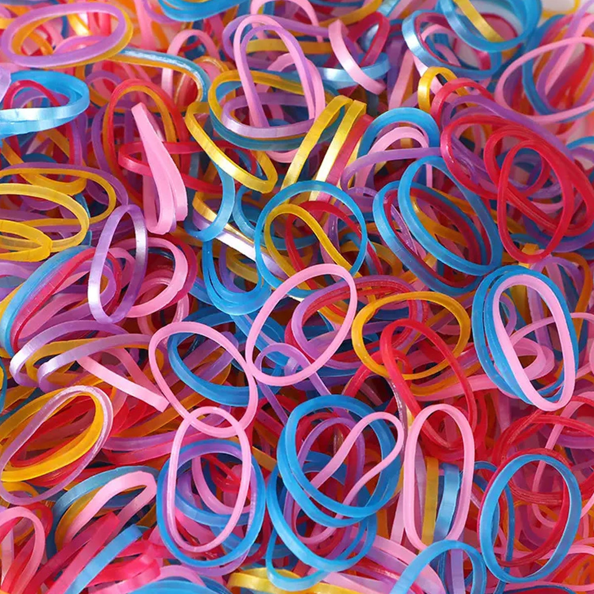 Multicolor rubber bands effectively bundling pencils and electronic cords on a desk.