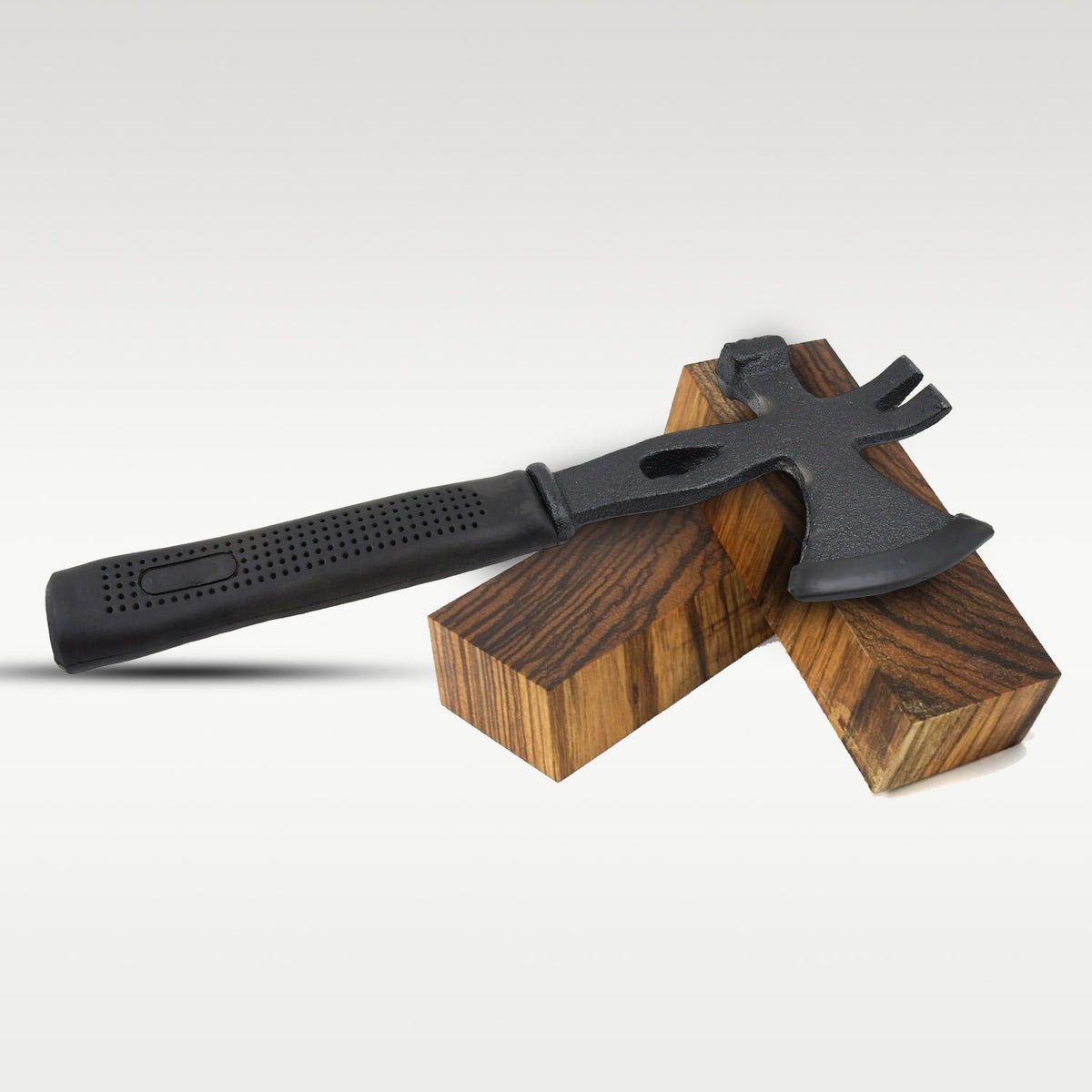 Multifunction axe with durable rubber handle for secure grip during outdoor tasks.