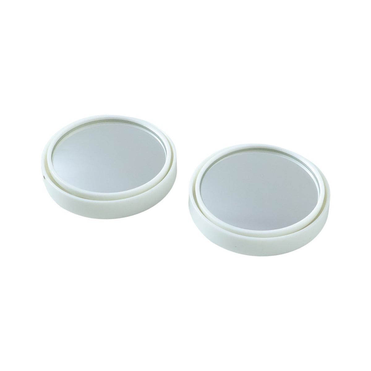 Close-up view of white round car blind spot mirror