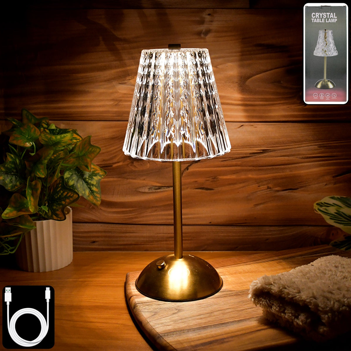 Crystal table lamp with elegant crystal shade on metallic base