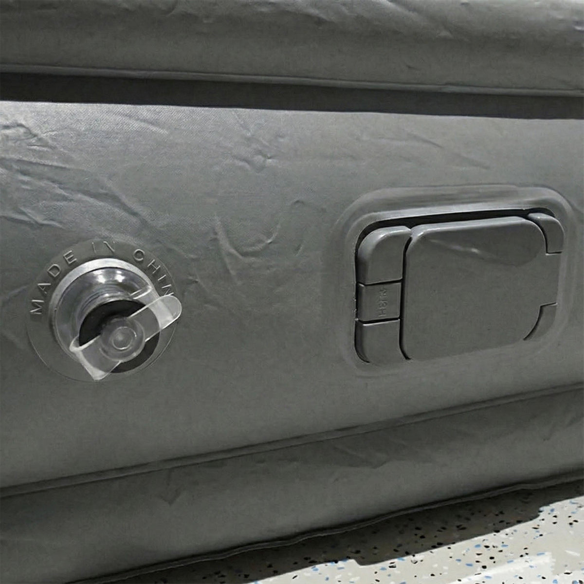 Portable inflatable bed partially folded illustrating compact and lightweight design