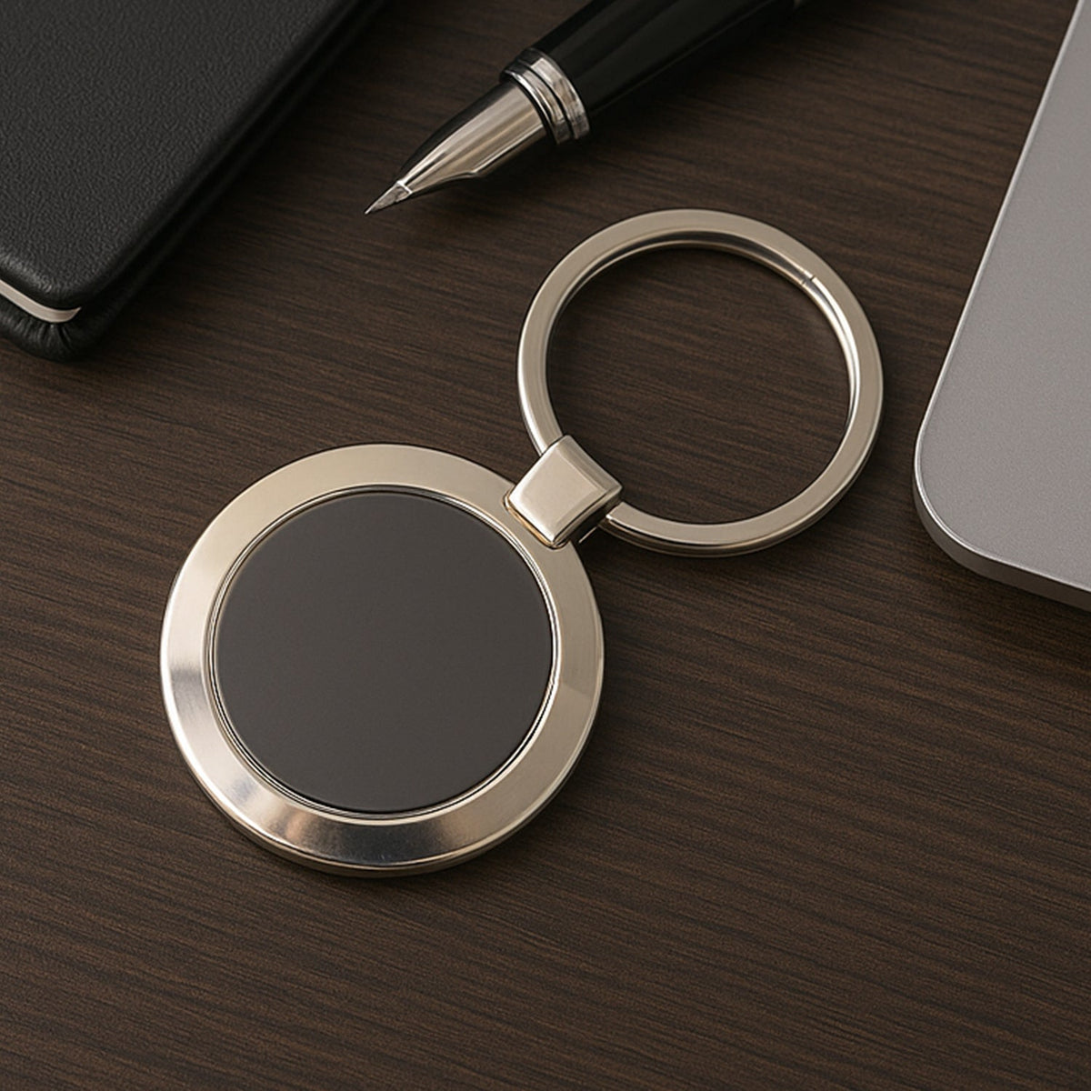 Durable round metal keychain with strong alloy build and black center.